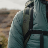 Close-up of Nebo Windbreaker and backpack strap, Detail view of Nebo Windbreaker shoulder and pack strap