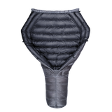 Top-down view of a backpacking quilt partially open, showing its black insulated interior and gray tapered footbox.