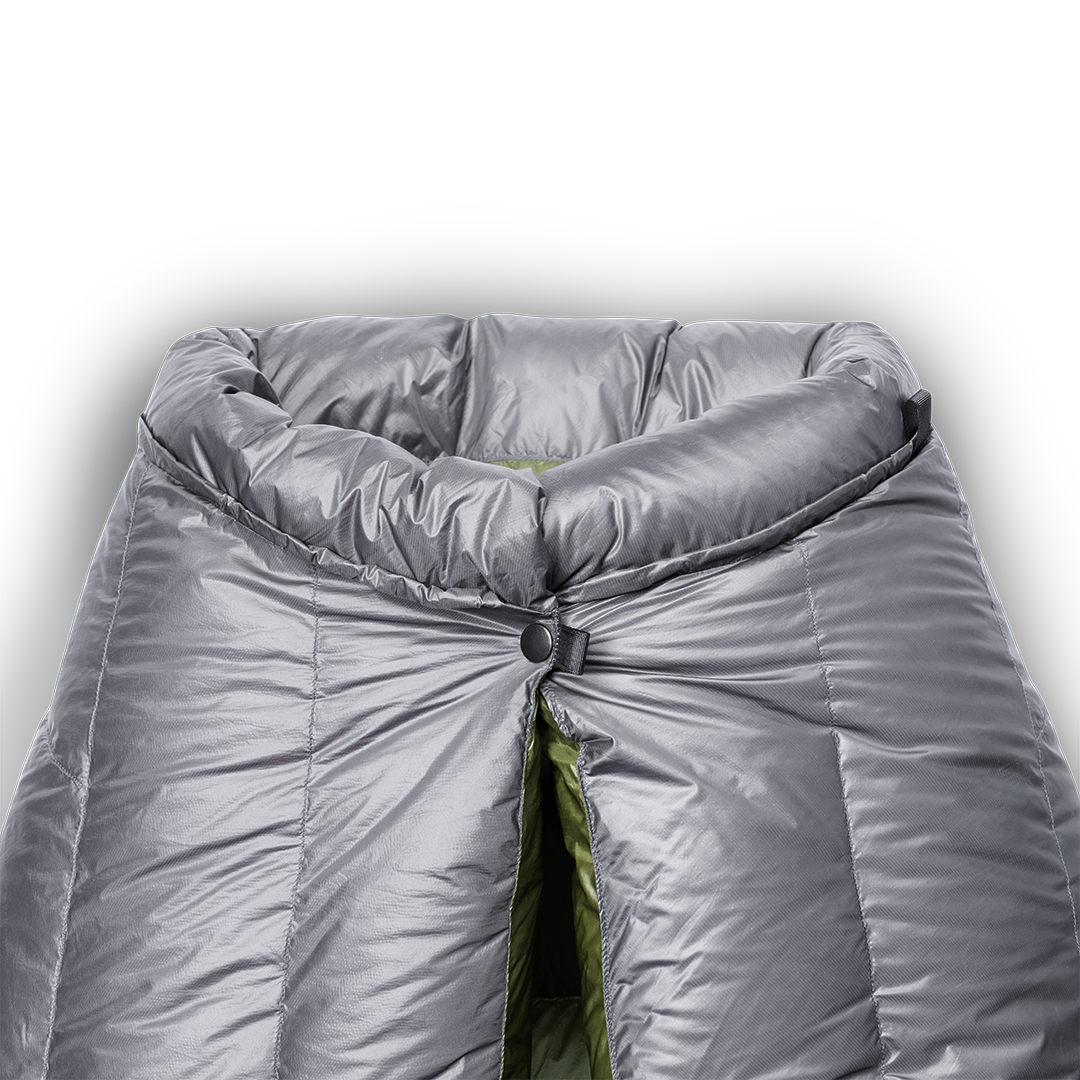 close view of snap closure near insulated draft collar of down top quilt. all-groups