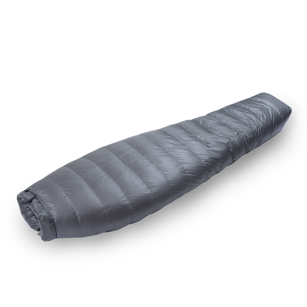 Diagonal view of a gray backpacking quilt fully closed, showing its tapered mummy-style shape and closed footbox.