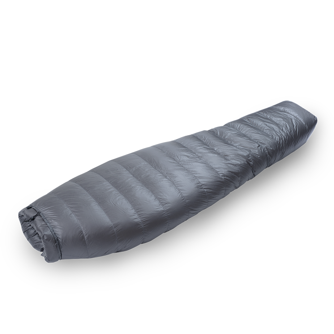 Diagonal view of a gray backpacking quilt fully closed, showing its tapered mummy-style shape and closed footbox.