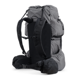 Side and rear angled view of the Shadowlight 60 ultralight backpack in gray, showing shoulder straps, hip belt, and large storage pockets.