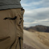 close side view of logo and pockets on men's brown hiking pants