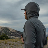 close side view of gray fleece hoodie on a man with the hood up