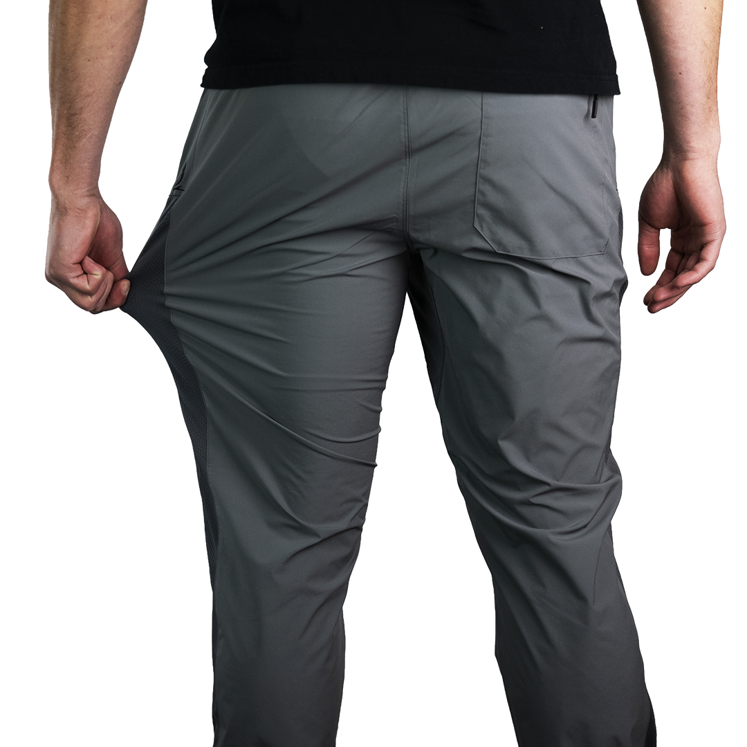 rear view of men's gray Skyline Trial Joggers being stretched