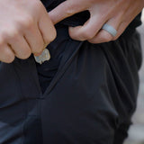 close view of key/card sleeve inside pocket of men's black trail shorts for running and hiking