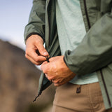 Adjusting the hem drawcord on Nebo Windbreaker, Nebo Windbreaker bottom cinch detail, Close-up of Nebo Windbreaker drawcord adjustment