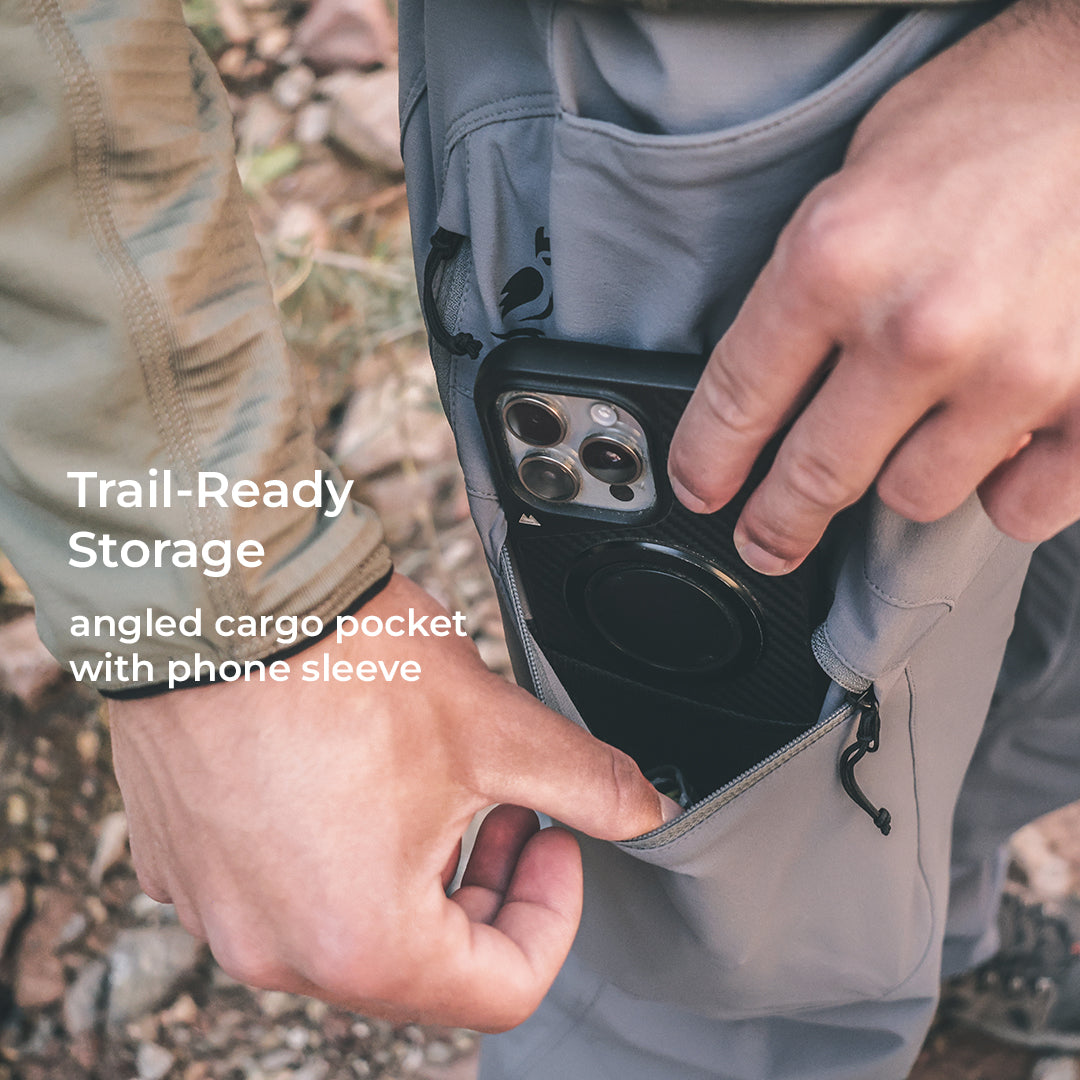 close view of angled pocket and phone sleeve on technical hiking pants
