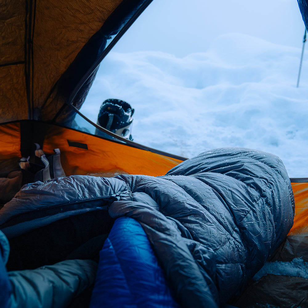 rear view of sleeping bag near tent door