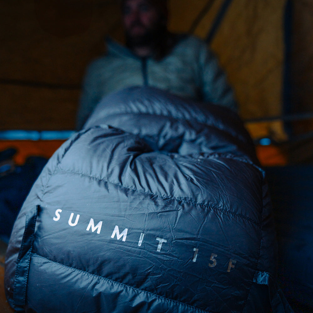close view of end of sleeping bag inside a tent