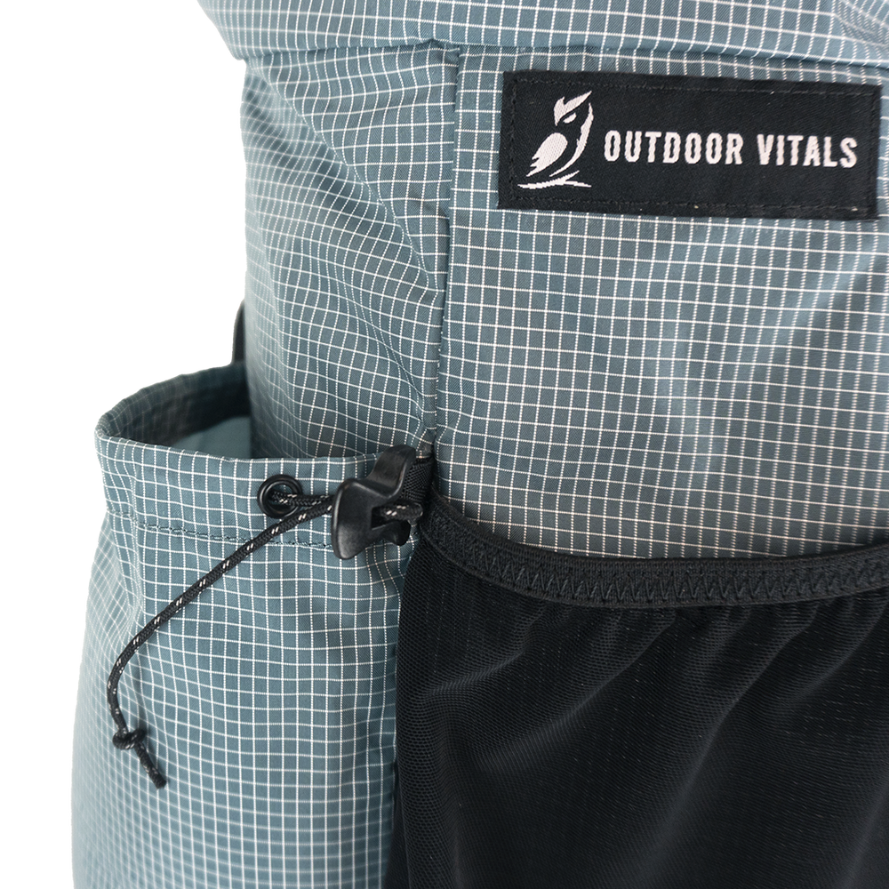 Detail of the Shadowlight Ultralight Backpack's side cinch pocket for secure storage
