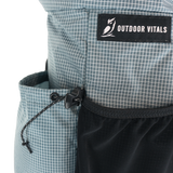 Detail of the Shadowlight Ultralight Backpack's side cinch pocket for secure storage
