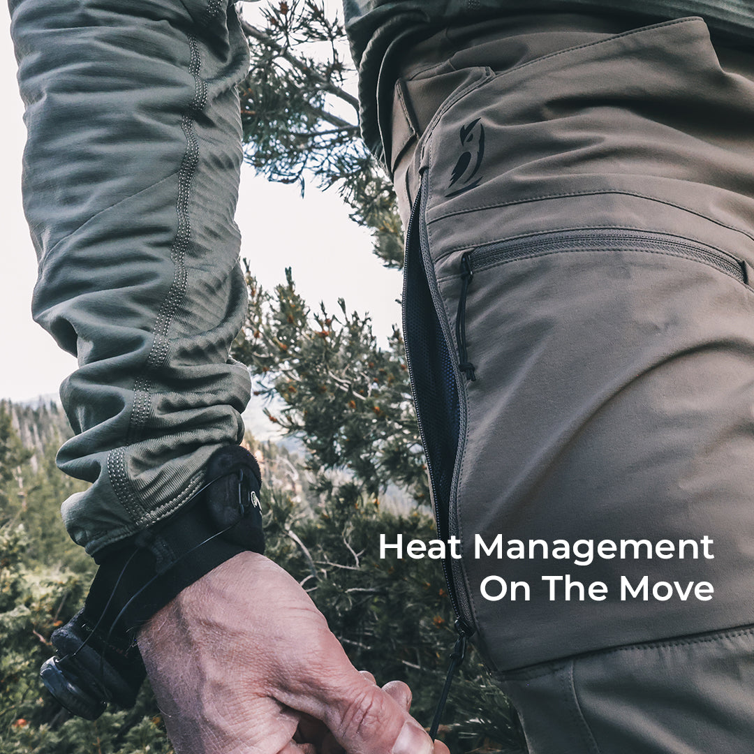 man unzips mesh-backed side vent in high mountain environment