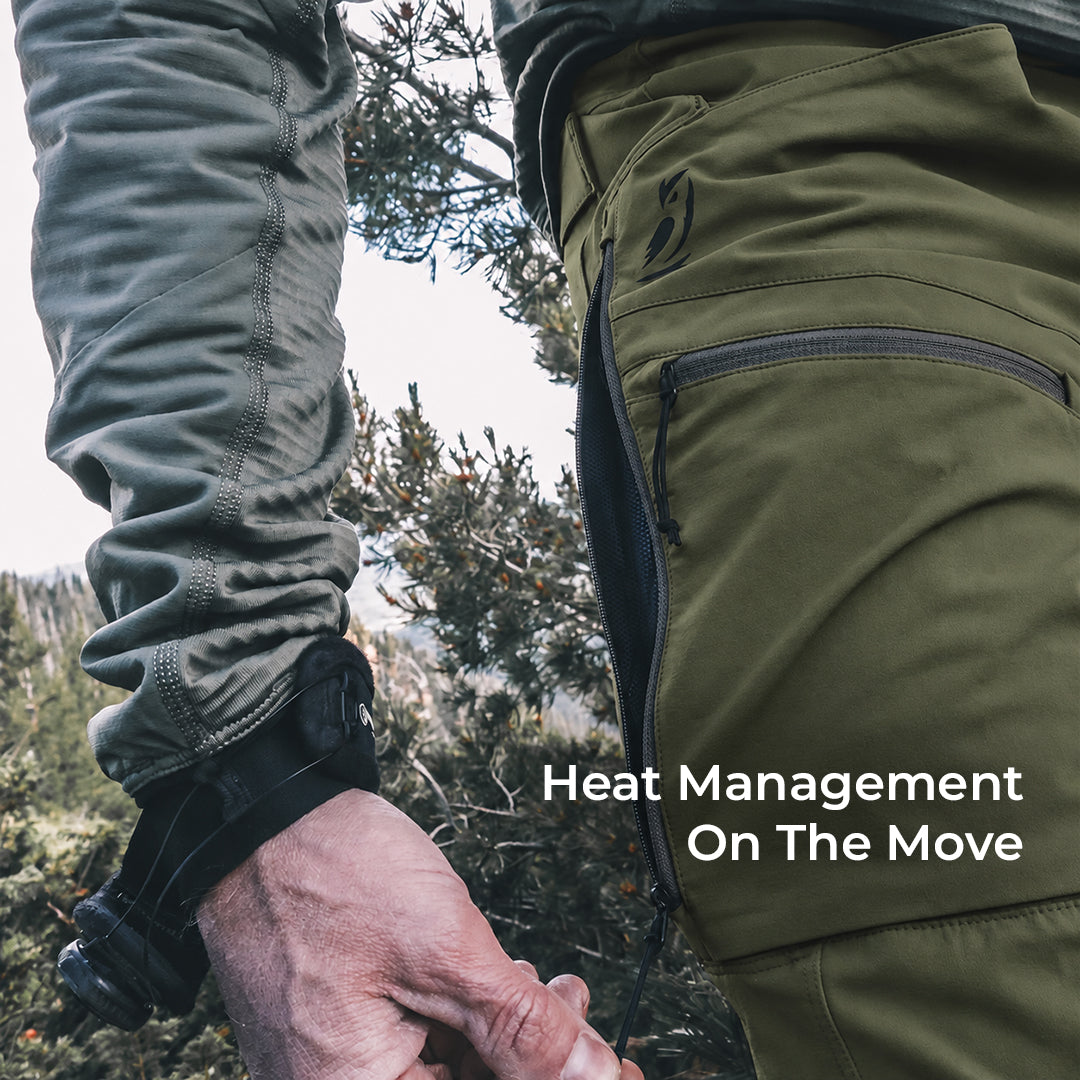 close view of man unzipping side vent on lightweight pants for mountain activity