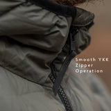 Detailed view of high-quality YKK front zipper on insulated jacket for smooth, reliable performance in outdoor use.