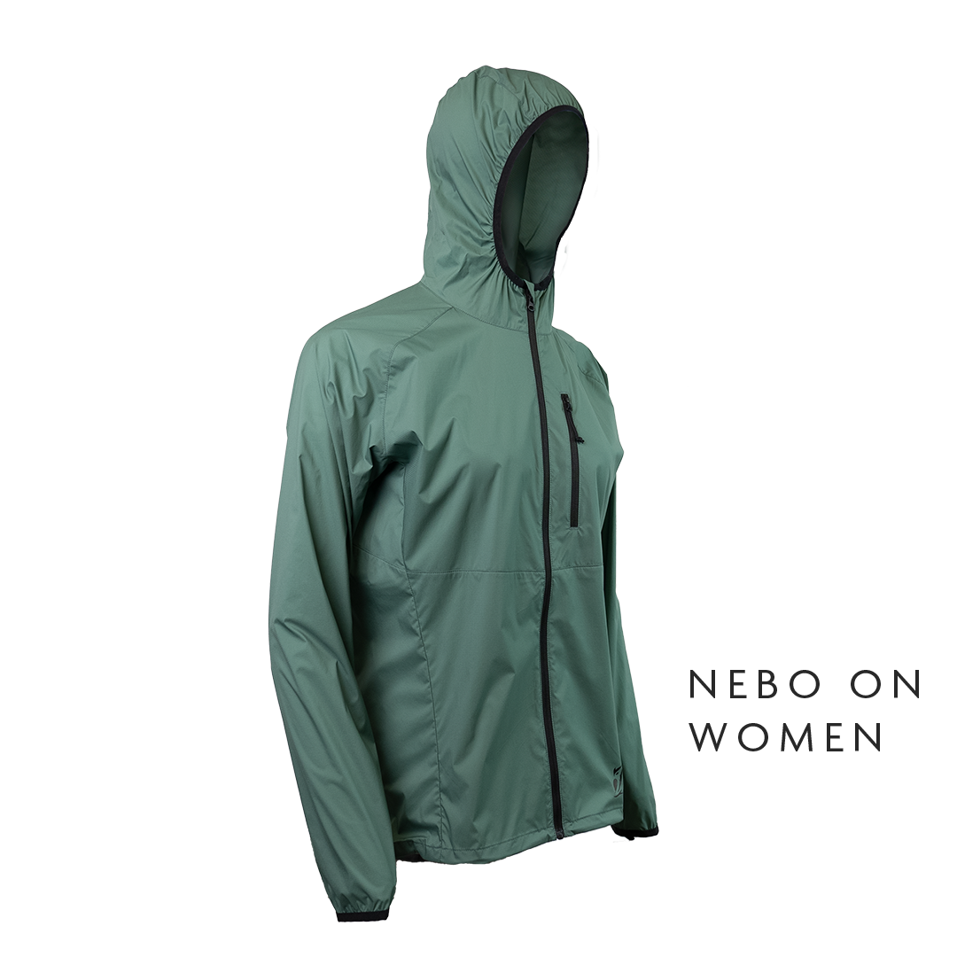 45 degree front right side view of dark forest colored windbreaker jacket for backpacking - no background