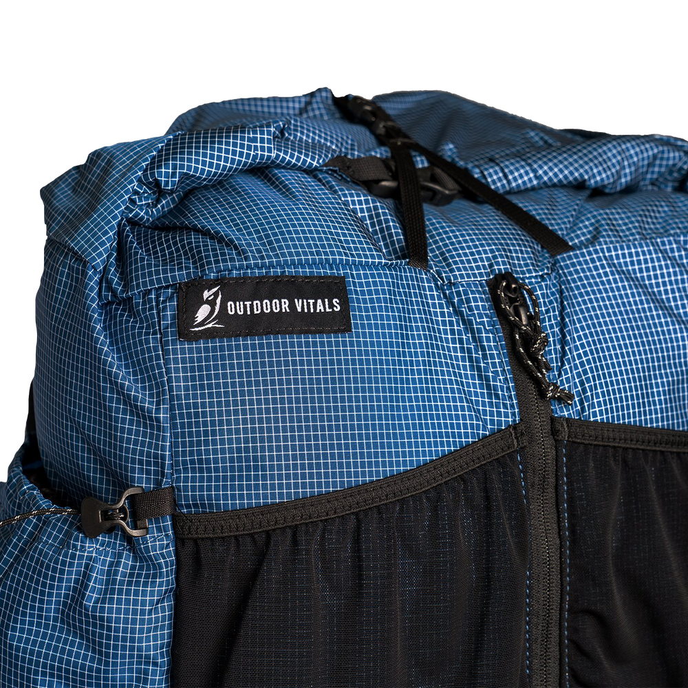 Close-up of the roll top & label on top of the Shadowlight Ultralight Backpack