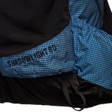The Shadowlight Ultralight Backpack featuring a blue and black color scheme & 60L capacity