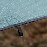 close view of water beading up & rolling off ultralight tarp fabric