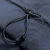 close view of hem adjustment cord on men's active mid layer hoodie for backpacking