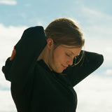 Woman wearing black Nebo Windbreaker outdoors, Black Nebo Windbreaker worn during outdoor activity