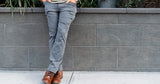 front view of man wearing charcoal trail pants in the city