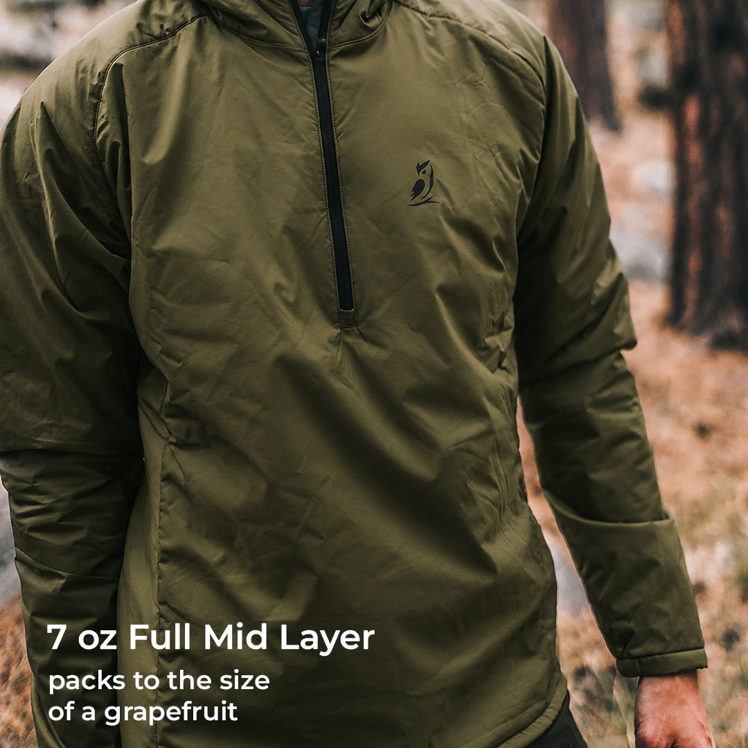 front view of green active mid layer on man in forest