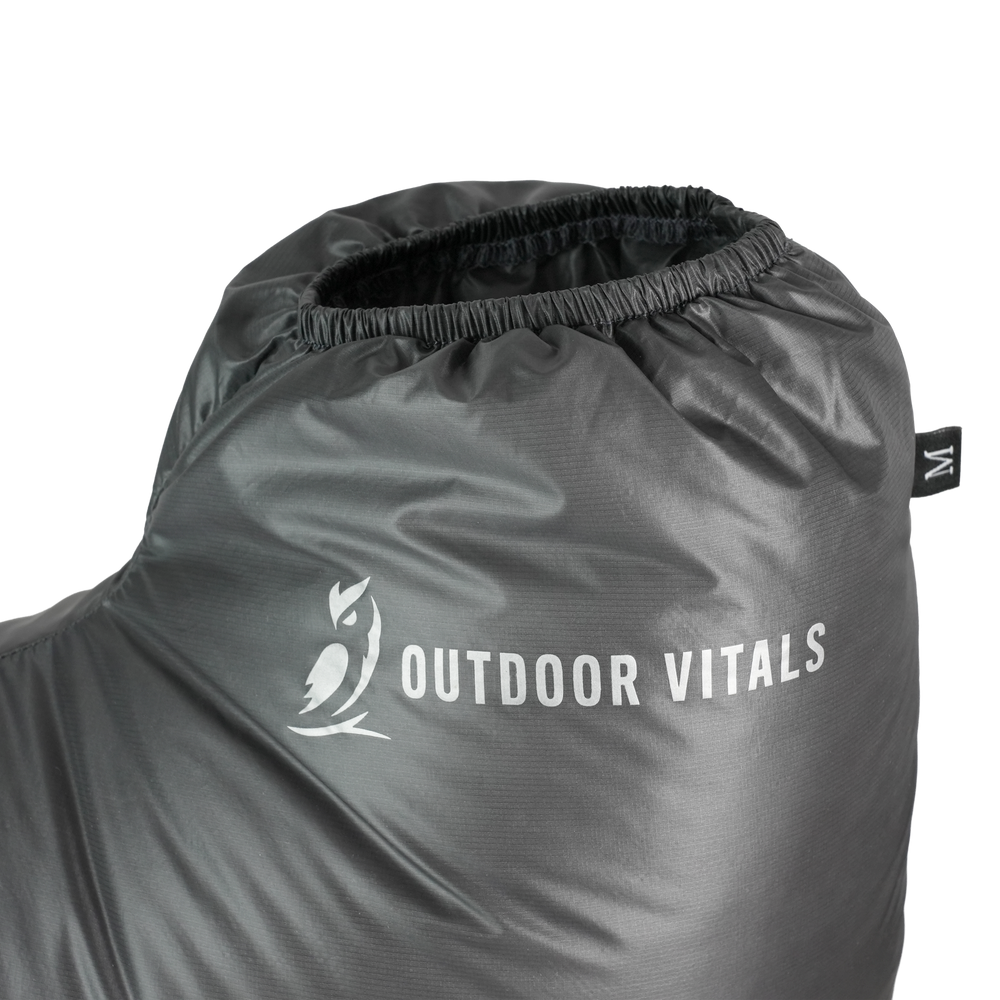 Ultralight down camp booties with elastic ankle cuff and Outdoor Vitals logo close-up