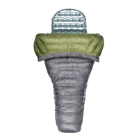 Top-down view of a gray and green backpacking quilt partially open, shown with a silvery inflatable sleeping pad inside.