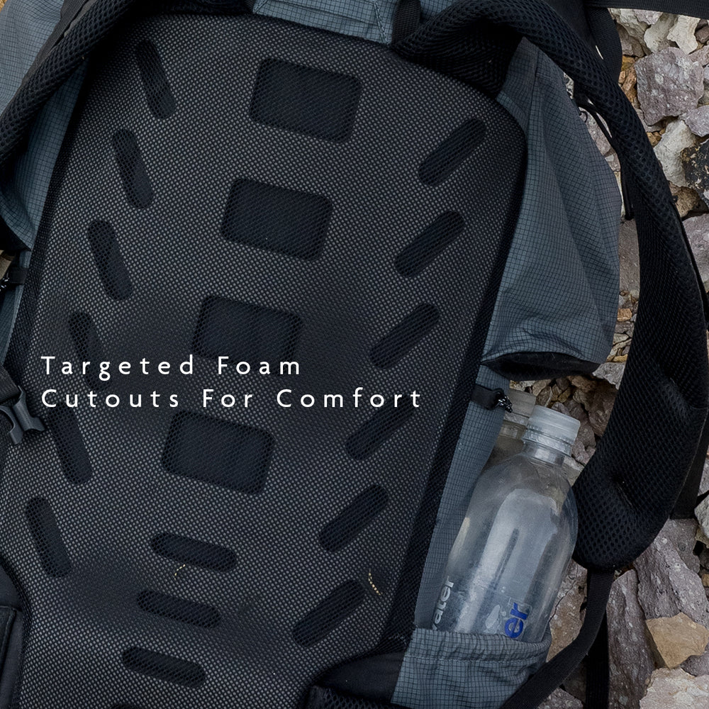 Close-up of Shadowlight backpack back panel showing targeted foam cutouts designed for comfort and ventilation.