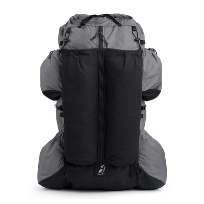 Front view of the Shadowlight 60 ultralight backpack with large external mesh pocket and roll-top closure system.
