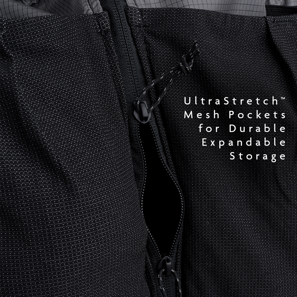 Close-up of the Shadowlight 60 backpack’s stretch mesh front pocket with vertical zipper for additional storage access.
