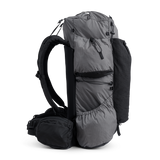 Side view of the Outdoor Vitals Shadowlight backpack showing large side pockets, hip belt pocket, and streamlined suspension system.