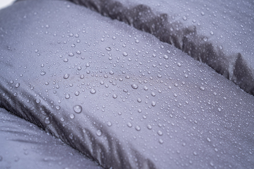 close view of water beading up on DWR treated sleeping bag fabric