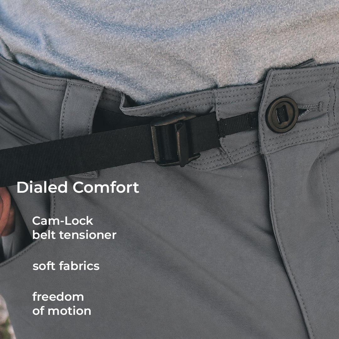 close view of adjustable cam-lock belt tensioner on lightweight pants built for rugged mountain use