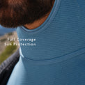 view of a person wearing a sun protection shirt, showing the neck and upper chest