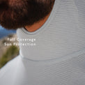 Gray - view of a person wearing a sun protection shirt, showing the neck and upper chest