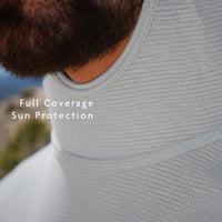 Gray - view of a person wearing a sun protection shirt, showing the neck and upper chest