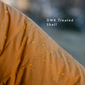 Close-up of jacket shell fabric with water beading on the surface, demonstrating durable water-resistant (DWR) treatment.