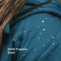 Close-up of a teal-blue hooded jacket with water droplets on the surface, showing a DWR treated shell. White text in the lower left reads 'DWR Treated Shell'.