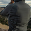 close rear view of gray hybrid fleece hoodie on man 