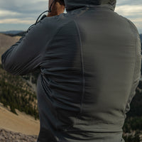 close rear view of gray hybrid fleece hoodie on man 