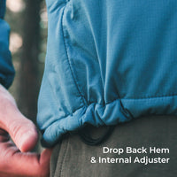 Close-up of a person wearing a blue lightweight puffer jacket, showing the gathered drop-back hem and internal adjuster, with a hand pulling the hem. White text in the lower right reads 'Drop Back Hem & Internal Adjuster'.