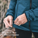 Close-up of a person outdoors adjusting the hem of a teal-blue jacket, with text reading 'Drop Back Hem & Internal Adjuster'.