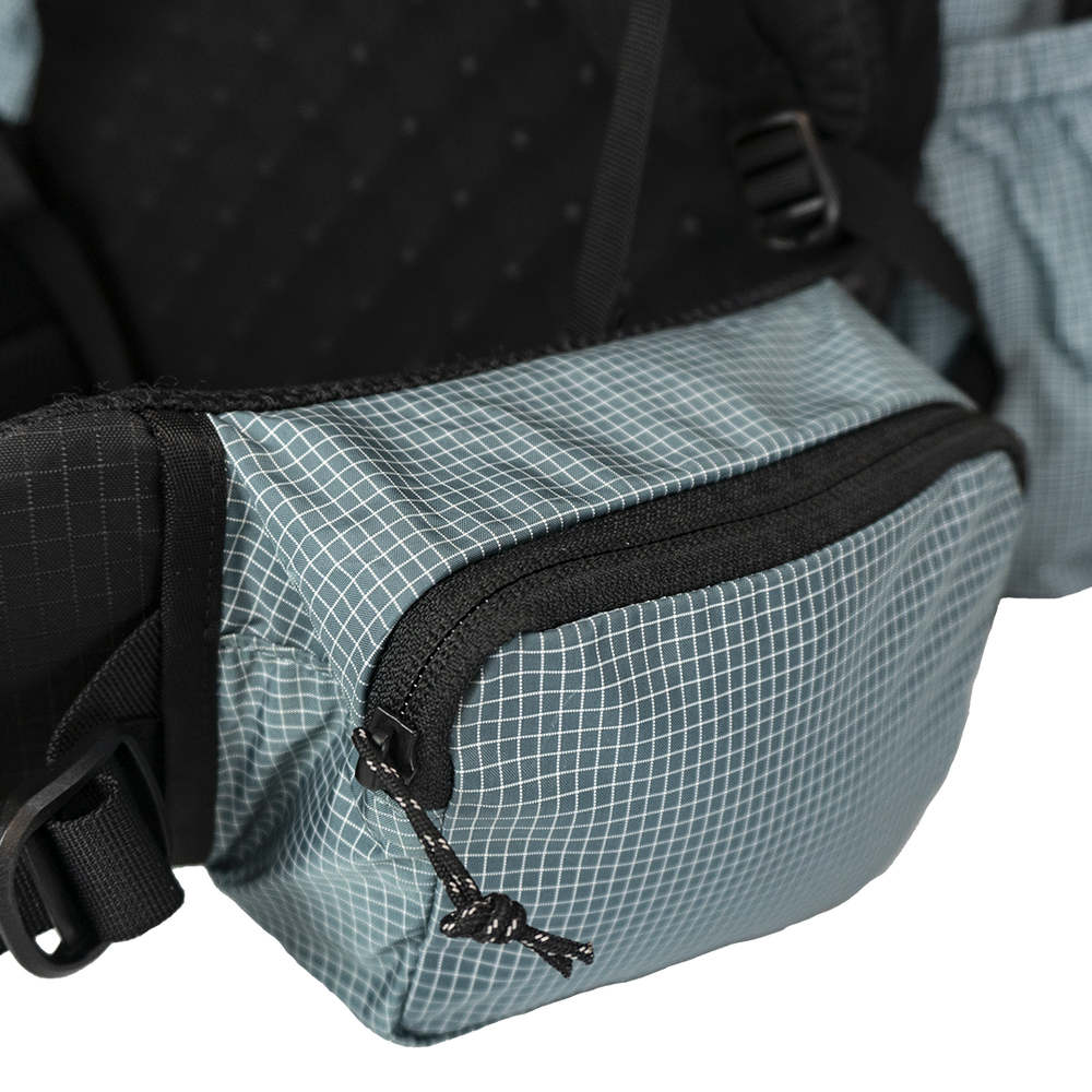 Side profile of the Shadowlight Ultralight Backpack highlighting its spacious hip belt pockets