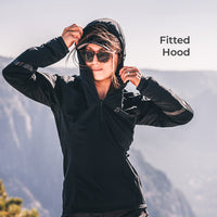 woman wearing black jacket with hood in high mountain environment