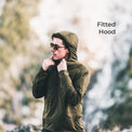 close view of man wearing hooded jacket in mountain terrain