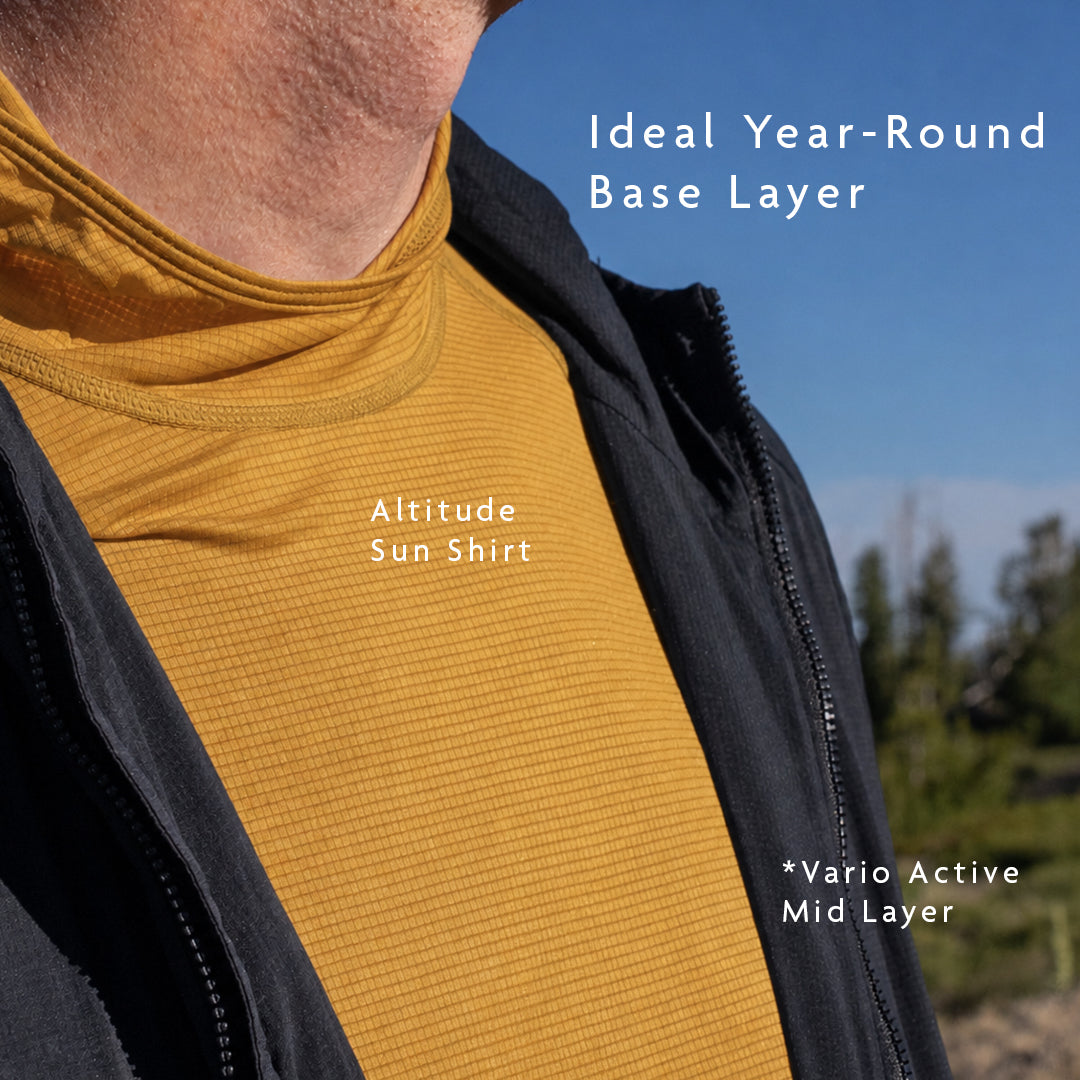 Golden - close view of sun hoodie being worn beneath ultralight mid layer