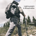rear view of hiker wearing gray vented pants hiking up mountain slope