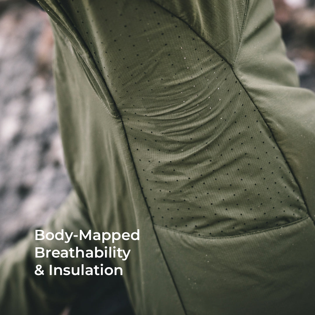 Close-up of an olive green technical jacket with a dotted breathable fabric panel and the text 'Body-Mapped Breathability & Insulation' overlaid on the lower left.